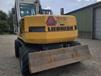 Bandenkraan / Graafmachine op wielen Liebherr 312 banden kraan graafmachine