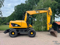 Bandenkraan / Graafmachine op wielen Caterpillar m313d Mobiele kraan